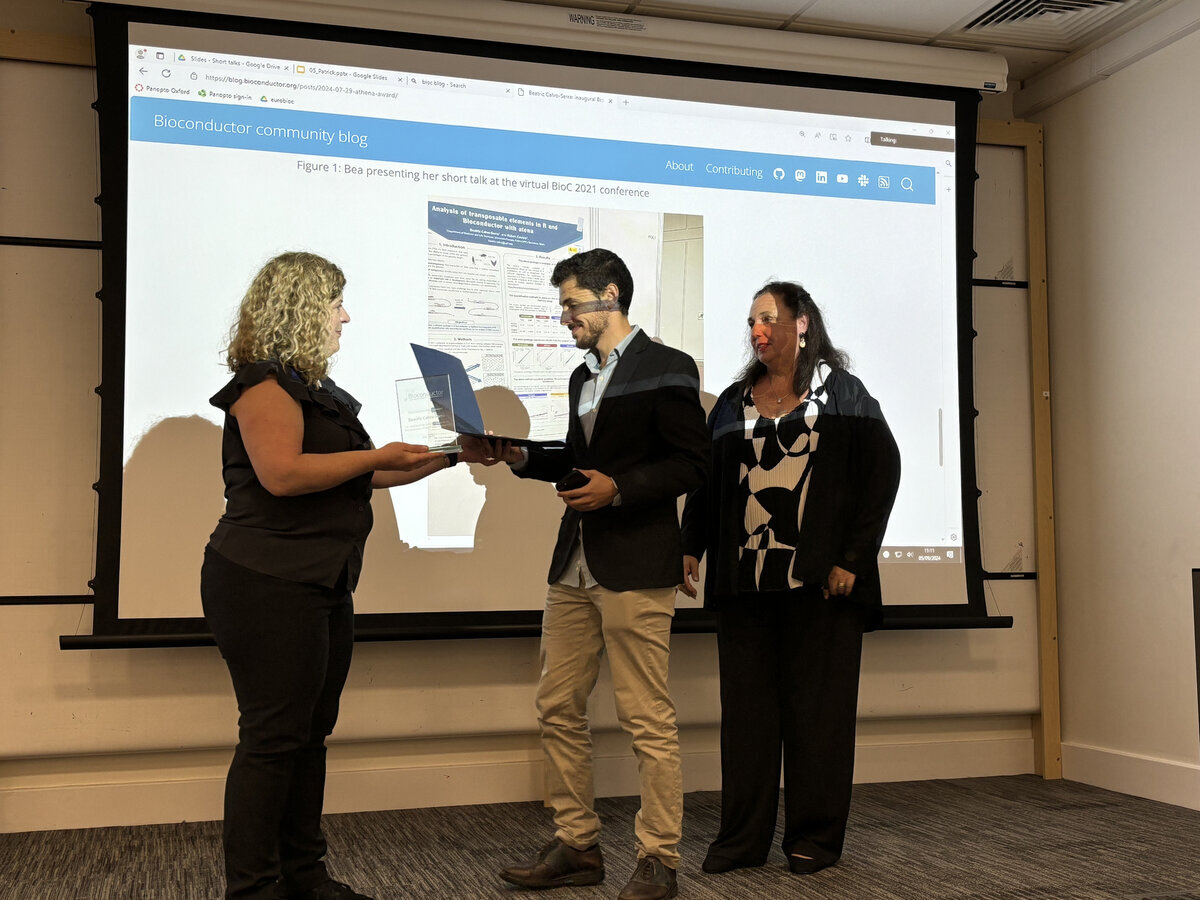 Aedin Culhane, Bioconductor Community Advisory Board (CAB) member, presenting Bea's brother and mother with Bea's Athena award at EuroBioC2024, an award originally proposed by Aedin to the CAB.